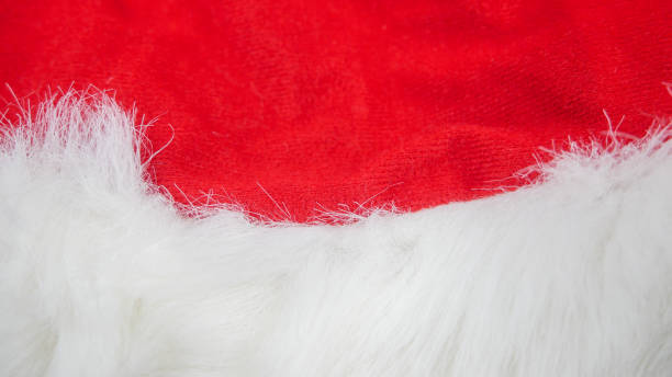 istock red and white fabric christmas background, red cloth and soft white fur 1188404547