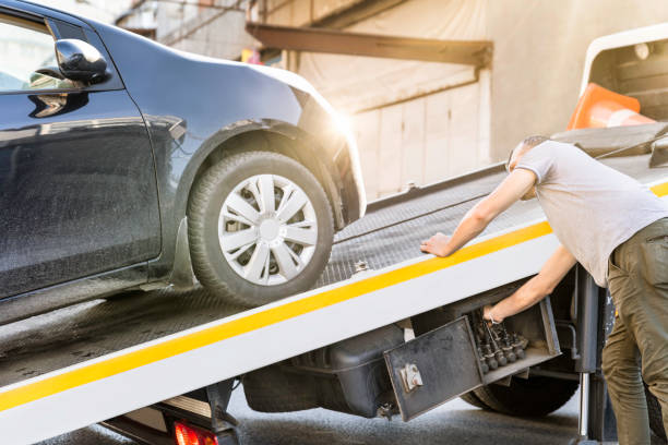 Car Loaded Onto A Recovery Truck For Transportation Pick-up Truck, Tow Truck, Accidents and Disasters, Roadside Assistance, Insurance tow truck stock pictures, royalty-free photos & images