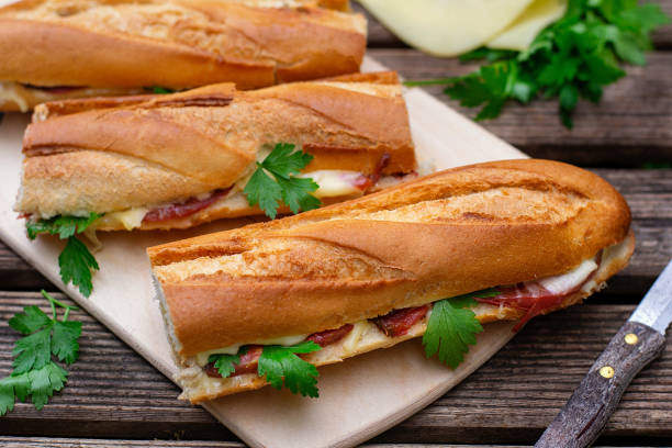 istock Oven baked baguette sandwich with cheese, ham and tomato 1188405718