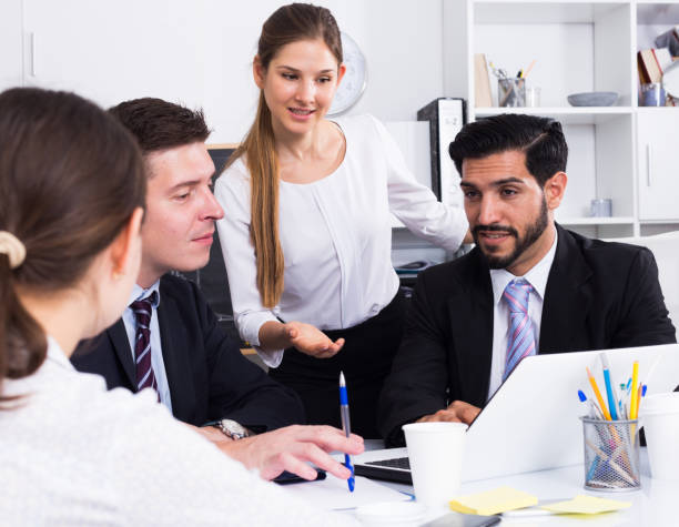 istock Businesswoman discussing business project with team 1188405892
