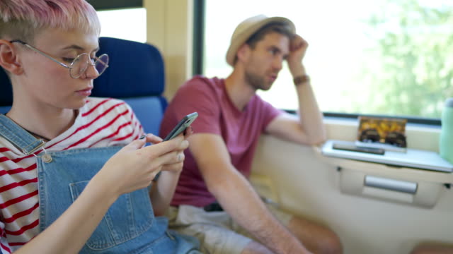 Girl and phone on train
