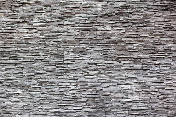 istock Beautiful wall decoration of gray modern stones bricks, background 1188408944