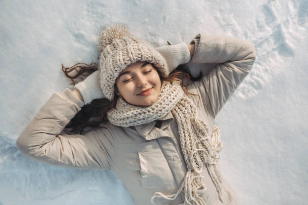istock Woman Lying on the Snow 1188409091