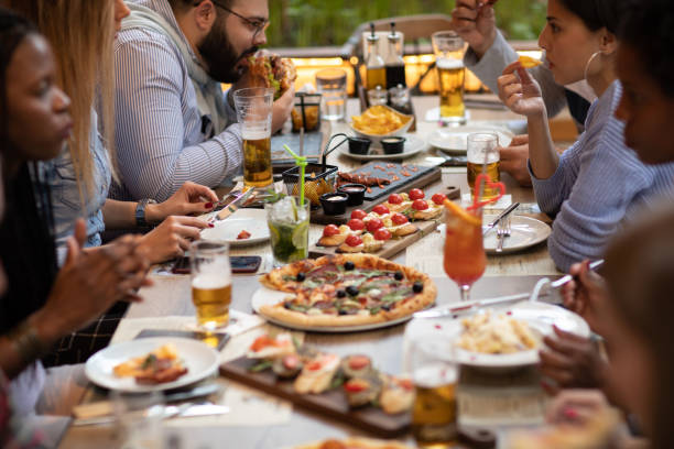 istock Group of friends on lunch outdoors in restaurant 1188409651