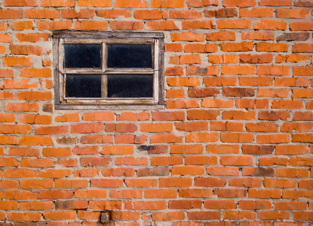istock Brick wall and wooden windows. Old building. 1188409806