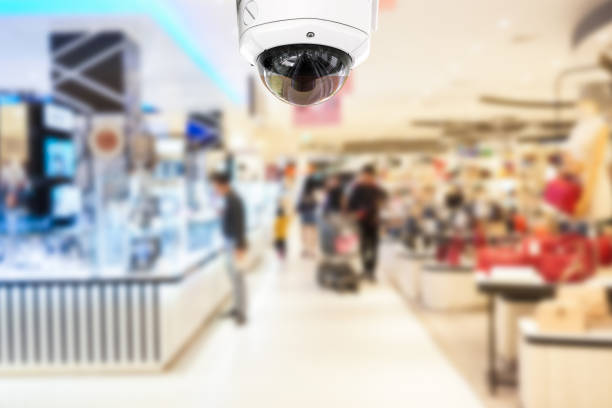 istock Security Camera Against People In Shopping Mall 1188415823