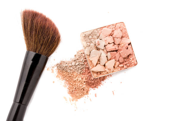 istock Multicolored crushed eyeshadows with brush isolated on white background. 1188419847