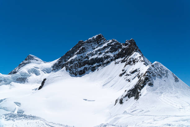 istock Panoramic view on winter snowy mountains 1188420725