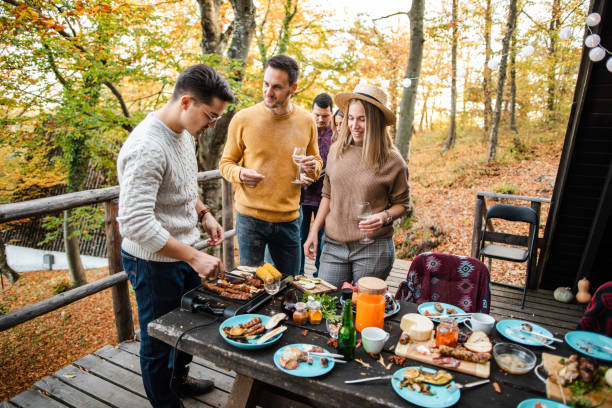 istock Preparing food outdoors together 1188421171
