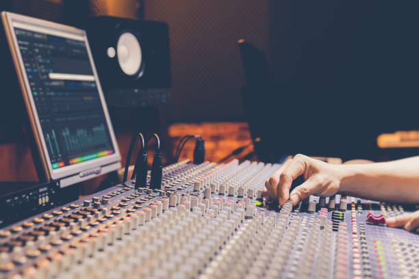 istock male producer, sound engineer hands working on audio mixing console in broadcasting, recording studio 1188421379