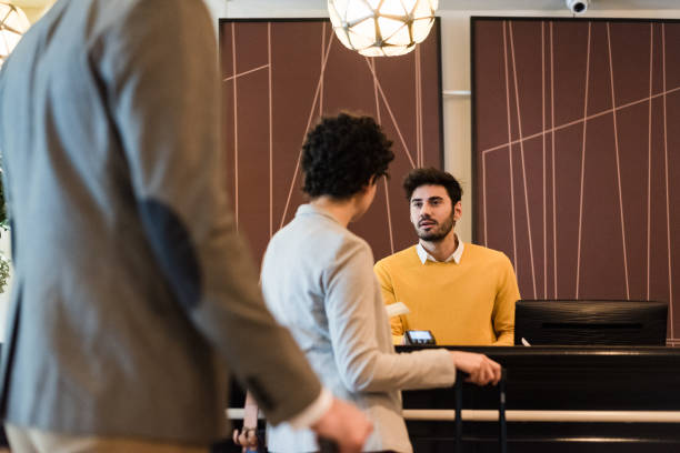istock Traveler couple checking in at hotel 1188422148