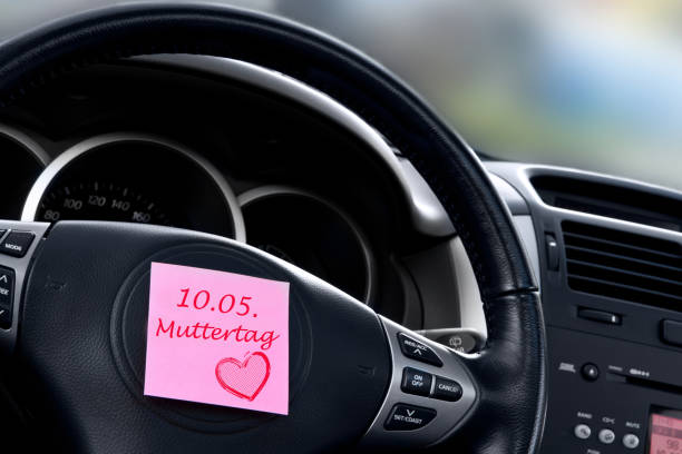 German Mother's Day car dashboard background with label stock photo