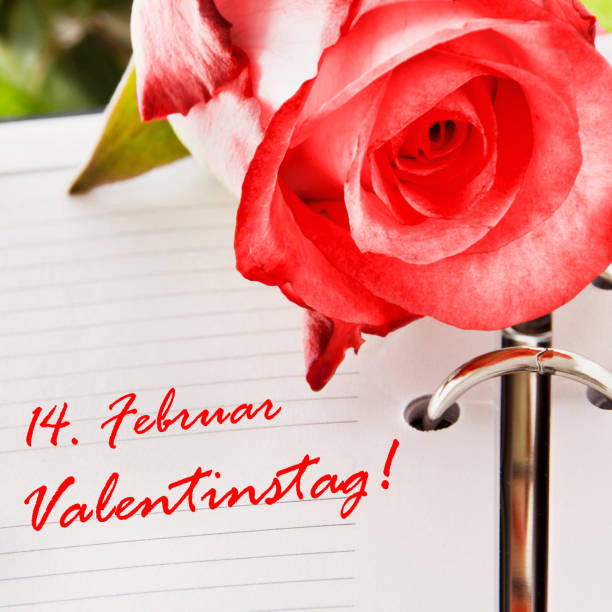 istock German Valentine's Day Calendar and pink rose as background 1188422330