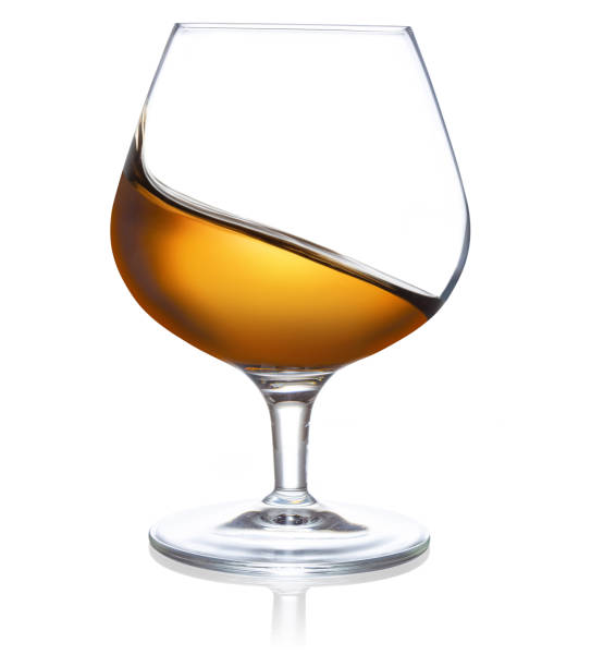 istock splashing golden liquor on white background 1188423731