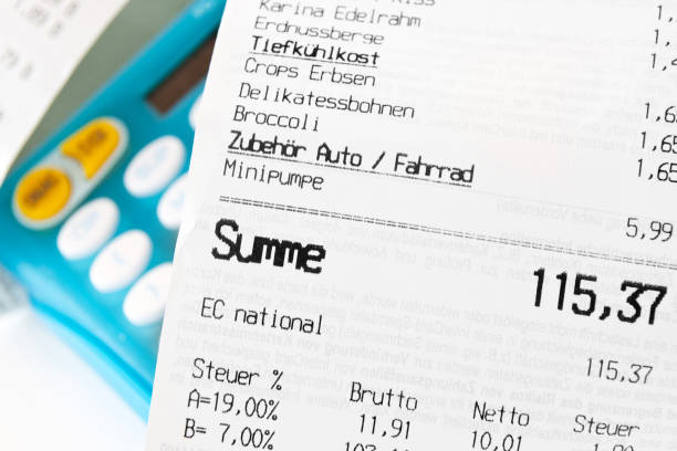 istock Receipt with pocket calculator as background close-up view 1188424930