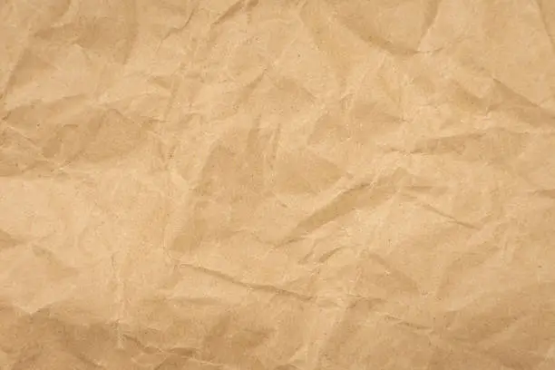 Photo of Crumpled brown paper texture vintage background.