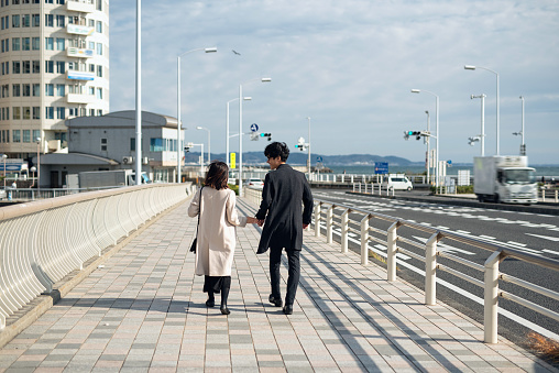 Couple dating in tourist spot of Enoshima district in Japan