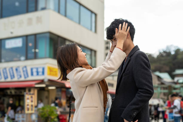 Couple dating and flirting in famous tourist spot Couple dating in famous tourist spot, Enoshima-Island in Japan fujisawa kanagawa photos stock pictures, royalty-free photos & images