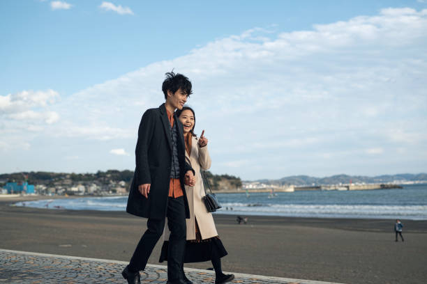 istock Couple walking at beach 1188426472