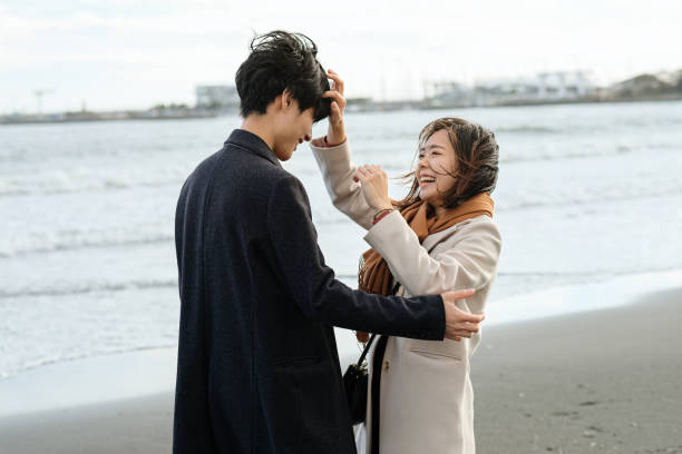 istock Couple flirting at beach 1188426575