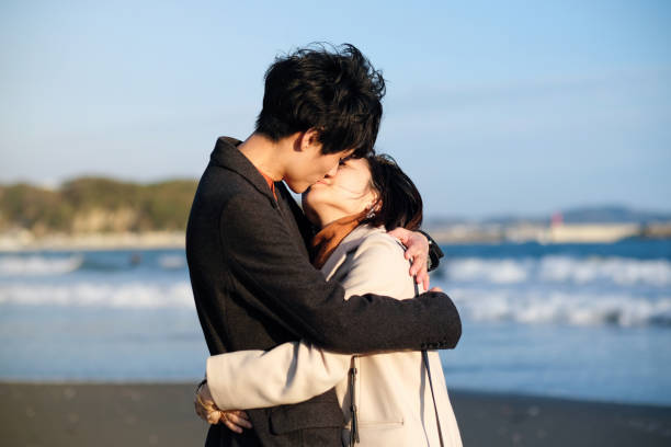 istock Couple kissing at beach 1188426848