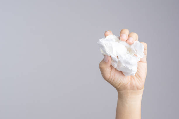 istock Hand holding crumpled tissue paper 1188428256