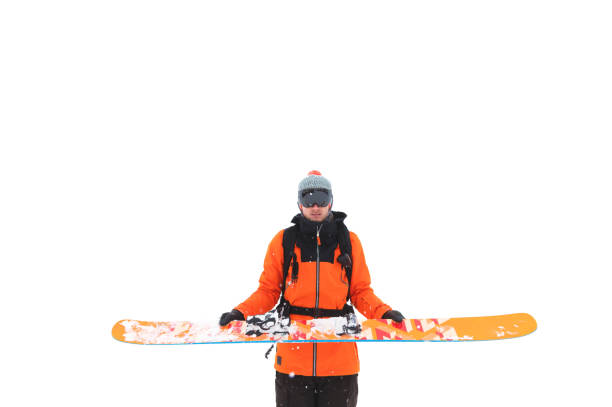 istock Professional male skier throws a ski over his arms spreading his hands to isolate on a white background. 1188428409