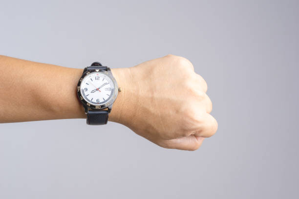 istock Hand with old and rusty wrist watch showing time over eight o'clock 1188428488