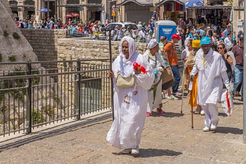 Pilgrim women from Ethiopia walking in a street at Jerusalem Old City, Israel. During Easter week, the city is very crowded and local people, tourists and pilgrims from everywhere participate in masses , processions and acts of faith.