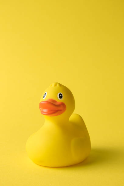 istock Rubber duck toy for swimming on yellow background. 1188429354
