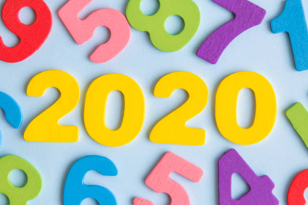 istock Numbers forming 2020 new year abstract on blue. 1188429392