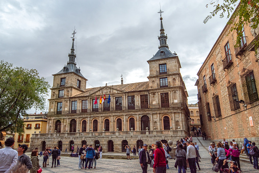 Toledo, Spain - November 1, 2019: Tourists in front of Town Hall in Toledo, Spain
