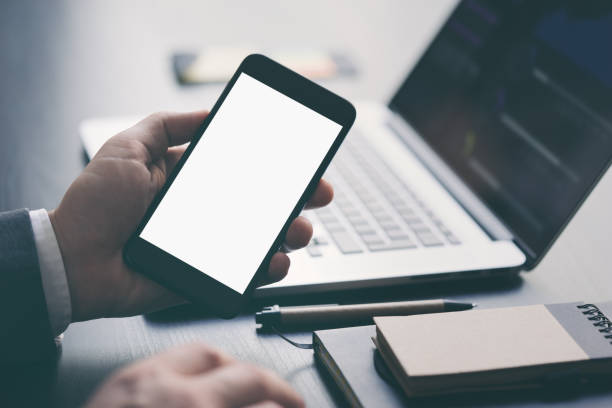 istock Close up of male hands with smartphone. Blank screen, Mock-up, copyspace ready for text or design 1188431999