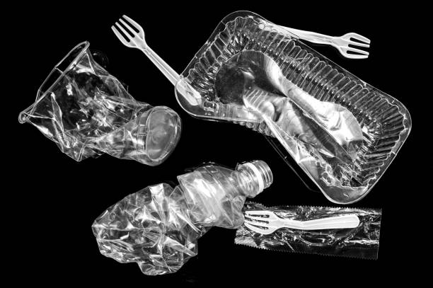 istock Various disposable crumpled plastic garbage isolated on a black background. Concept of recycling plastic and ecology. 1188432356