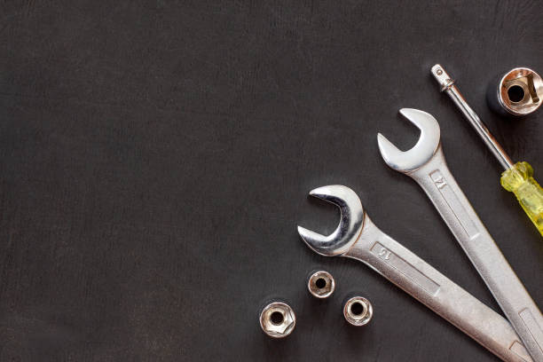 Tools for work. Wrenches, spanner on black background. Repair auto concept. Flat lay. Copy space. Top view