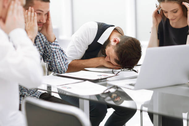 istock tired business team discussing the problems of a new startup. 1188434842