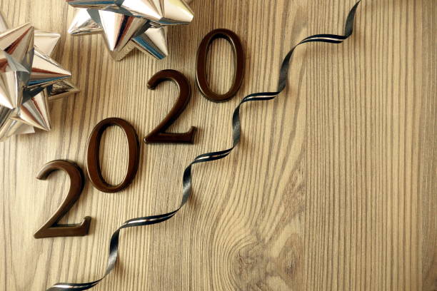 istock 2020 Happy New Year background with decoration on wood 1188435543