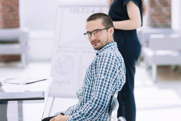 istock close up.young employee sitting at his Desk 1188436893
