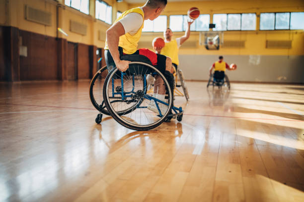 istock Men in wheelchair playing basketball 1188437039