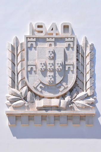 Escudo de armas de Portugal en piedra - 1940, Lisboa, Portugal photo