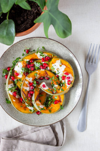 istock Grilled pumpkin with pomegranate and white sauce. Healthy eating. 1188438036