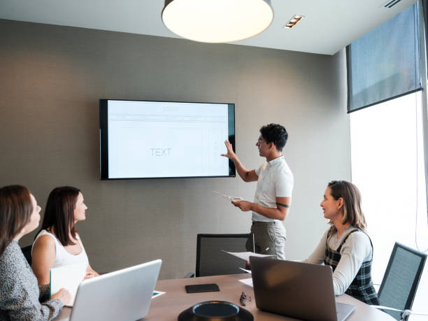 istock Young man presenting during meeting in conference room 1188439989