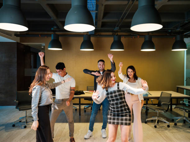 istock Young latin people dancing together in coworking space 1188440012