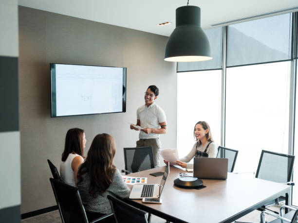 istock Young latin people smiling during presentation in conference room 1188440049