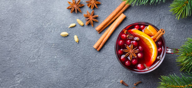 istock Mulled red wine with spices. Christmas decoration. Grey background. Copy space. Top view. 1188443143