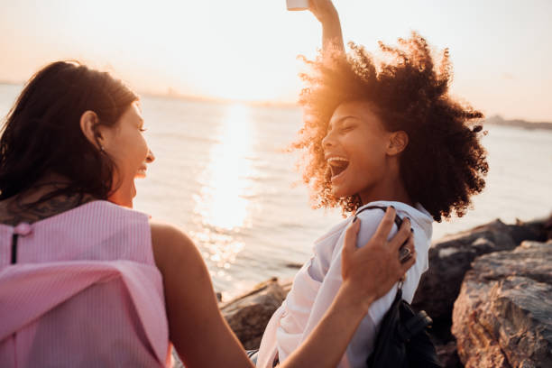 istock Two girls having fun by the sea 1188444693