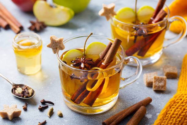 istock Apple mulled cider with spices in glass cup. Grey background. Close up. 1188444870