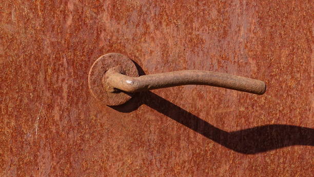Iron rusty door with a handle to another world.