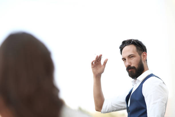 istock close up.businessman with a cigarette standing in the office 1188446335