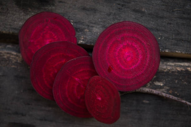Raw organic vegetables  beetroot slices on the table. Healthy clean eating. Different colorful vegetables on wooden board.